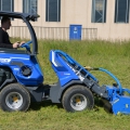 flail mower attachment for mini loader in action